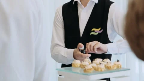 Waiter opens a bottle of champagne Stock Footage 282236953