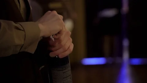 The waiter opens a bottle of wine Stock Footage 98222790