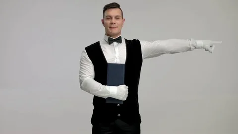 Waiter pointing right 스톡 동영상 77542695
