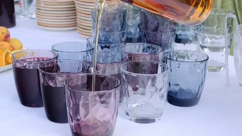 Waiter Pouring Juice Into A Glasses on a... | Stock Video | Pond5