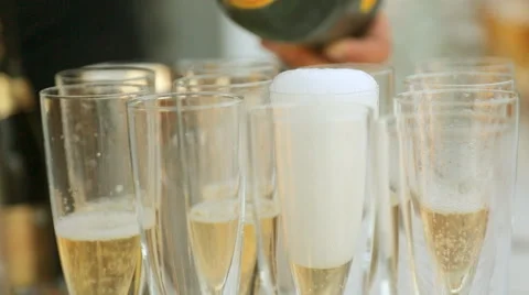 Waiter pours champagne into glasses Video stock 59658244