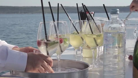 Waiter preparing coctail drinks for guests Stock Footage 83787157