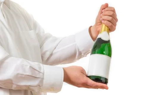 Waiter presenting a botle of champagne Stock Photos