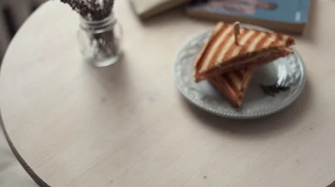 The waiter puts the coffee on the table Stock Footage 59804168