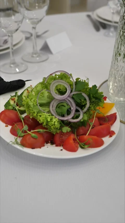 Waiter puts dish on table. festive table setting. luxury event organization Stock Footage 306885028
