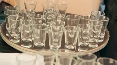 Waiter puts empty glasses on a tray at a banquet Stock Footage 54456692
