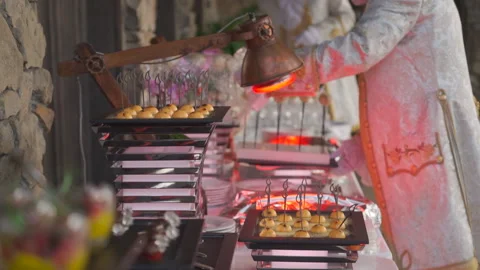 Waiter puts food on buffet table Stock Footage 150746975