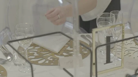 The waiter puts a glass on the table. table setting Stock Footage 110912682