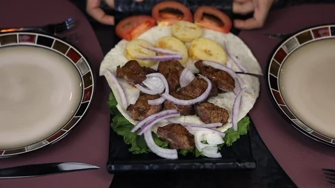 The Waiter puts order on the Table. Restaurant service Stock Footage 119113805