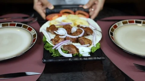The Waiter puts order on the Table. Restaurant service Stock Footage 119113948