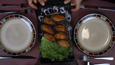 The Waiter puts order on the Table. Restaurant service Stock Footage 119114486