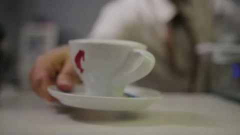 The waiter puts the prepared coffee on the table. Video stock 222056604