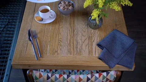 The waiter is putting the dish on the table Stock Footage 130851750