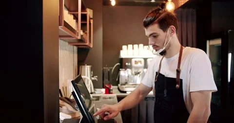 Waiter registering client's order in a computer at coffee shop Video stock 234720792