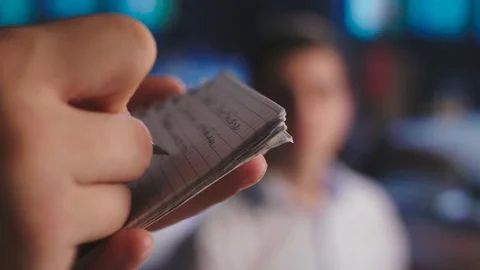 The waiter at the restaurant accepts the order, writes the order in a notebook. Stock Footage 82470043