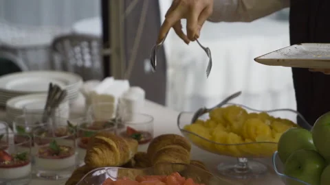 The waiter serves a buffet 스톡 동영상 155380325