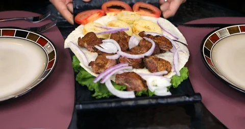 The Waiter serves dish on the Table Stock Footage 119357241