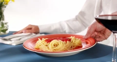 The waiter serves spaghetti in the restaurant. close-up. Stock Footage 248995282