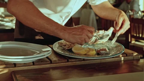 Waiter Serving and Deboning Grilled Fish – Algarve Ferragudo, Portugal Stock Footage 309869992