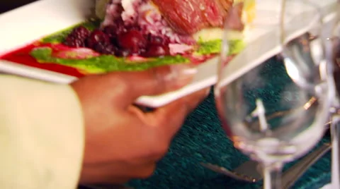Waiter serving appetizer on dining table Stock Footage 54590921