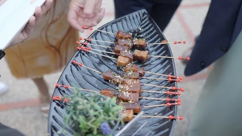 Waiter serving canaps at a banquet Stockbeeldmateriaal 116134387