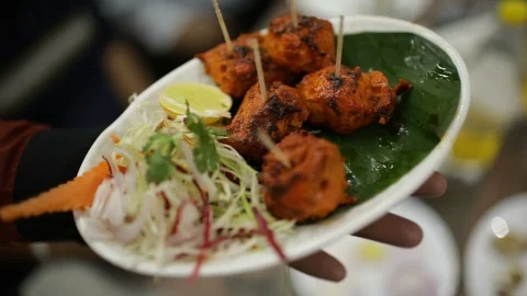 Waiter-serving-Chicken-kebab-2s Stock Footage 86833385