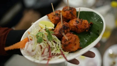 Waiter-serving-Chicken-kebabs Stock Footage 86833361