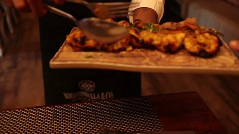 Waiter-serving-chicken-kebabs Stock Footage 118283808