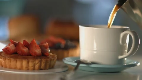 Waiter serving coffee in a cup Stock Footage 135698527