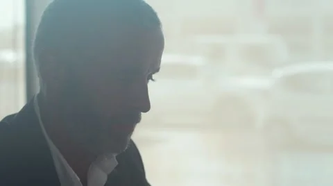 Waiter serving coffee to customer using laptop at cafe Stock Footage 64093582