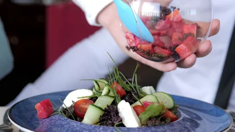 A waiter serving a customer in an elite restaurant. A close-up of a waiter Stock Footage 172358990