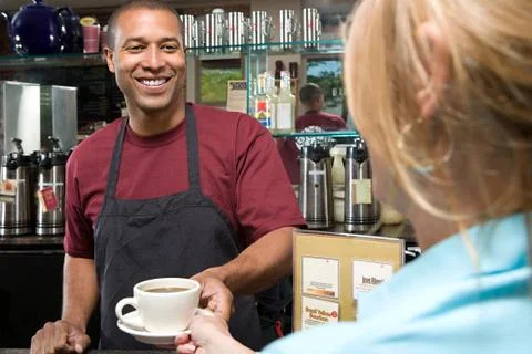 Waiter serving customer Stock Photos