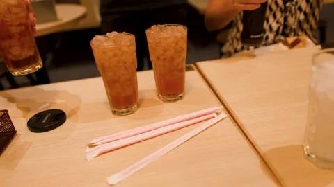 Waiter Serving Glasses of Iced Tea at Restaurant Table Stock Footage 346016803