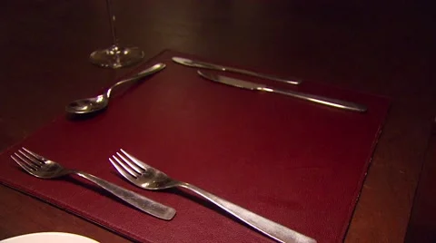 Waiter serving meal on set table Stock Footage 54591902