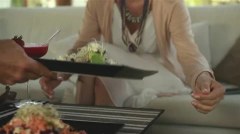 Waiter serving plates with salad in restaurant HD Stock Footage 10875680