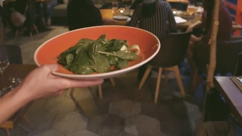 Waiter serving table on evening diner for the group of people. Stock Footage 99565476