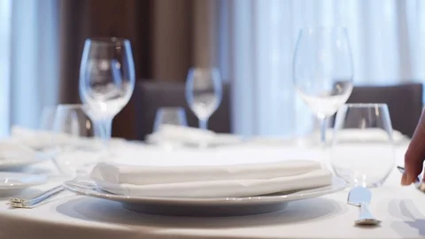 The waiter is serving a table in the restaurant. Stock Footage 113852537