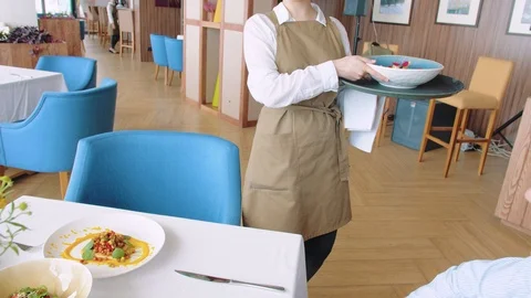 Waiter serving vegetable salad in cafe, closeup Stock Footage 114877128