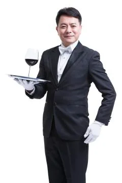 Waiter serving wine Stock Photos