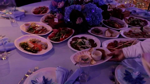 The waiter sets the dishes on the table Stock Footage 281941729