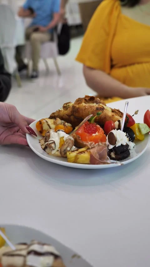 Waiter sets festive table with delicious dishes. festive table setting. Stock Footage 337587870
