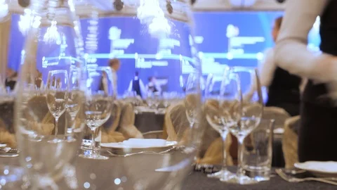 A waiter sets the table in a restaurant before customers arrive, and uses fine Stock Footage 117984838