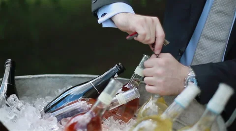 Waiter setting glasses and opening bottles of wine outdoors. 3 shots in sequence Stock Footage 46164476