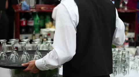 Waiter setting out glasses at wedding banquet Vídeo Stock 18117282