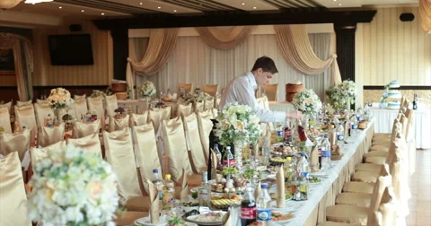 Waiter Setting Restaurant Table At Wedding Party Stockbeeldmateriaal 51448432