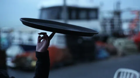 Waiter skillfully spinning tray on one finger, medium shot Stock Footage 50044092