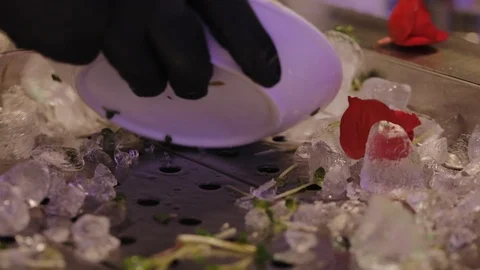 Waiter takes ice for a buffet table Stock Footage 122060084