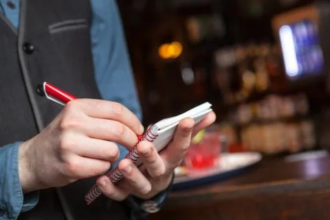 Waiter taking an order. Stock Photos