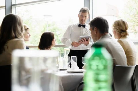 Waiter taking order with tablet computer Stock Photos