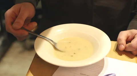 Waiter trying soup in restaurant Stock Footage 59538754